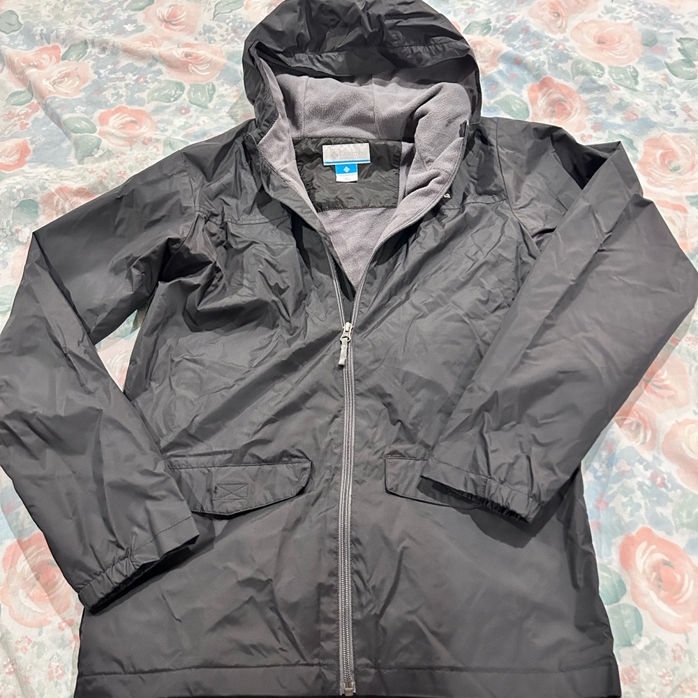 Youth Columbia Black rain Jacket with upper body fleece lining.